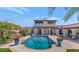 Backyard pool surrounded by patio, lounge chairs, and lush landscaping at 4726 E Sierra Vista Dr, Paradise Valley, AZ 85253