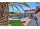 Inviting backyard pool with lounge chairs, manicured lawn, and mature landscaping at 4726 E Sierra Vista Dr, Paradise Valley, AZ 85253