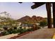 Picturesque view from the home showcasing nearby mountains and rooftops at dusk at 4726 E Sierra Vista Dr, Paradise Valley, AZ 85253