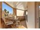 Relaxing balcony with a table and chairs, perfect for enjoying the outdoor view at 4850 E Desert Cove Ave # 227, Scottsdale, AZ 85254