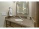 Modern bathroom features granite countertops, updated faucet, and a framed mirror at 4850 E Desert Cove Ave # 227, Scottsdale, AZ 85254