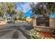 The Village at Stone Creek Condominiums entrance sign with well-maintained landscaping at 4850 E Desert Cove Ave # 227, Scottsdale, AZ 85254