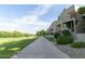 A tranquil view of the community pathway running next to a community golf course at 4850 E Desert Cove Ave # 227, Scottsdale, AZ 85254