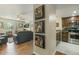 Open-concept living space with stainless steel kitchen appliances and sleek countertops at 4850 E Desert Cove Ave # 227, Scottsdale, AZ 85254