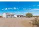Wide exterior view of a home and detached garage in a desert environment at 53040 W Whirly Bird Rd, Maricopa, AZ 85139