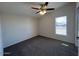 Clean bedroom with ceiling fan, neutral walls and comfortable carpeting at 538 S 98Th St, Mesa, AZ 85208