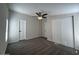 Bedroom featuring plush carpeting, a ceiling fan, and closets for storage at 538 S 98Th St, Mesa, AZ 85208