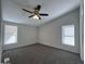 Bedroom featuring plush carpeting, a ceiling fan, and two windows at 538 S 98Th St, Mesa, AZ 85208