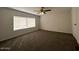 Bedroom featuring plush carpeting, a ceiling fan, and natural light at 538 S 98Th St, Mesa, AZ 85208