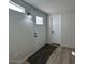 Entryway featuring a glass-paneled front door and modern lighting at 538 S 98Th St, Mesa, AZ 85208