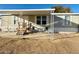 Inviting single-story home with a covered porch and outdoor seating area at 538 S 98Th St, Mesa, AZ 85208