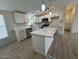 Modern kitchen featuring white cabinetry, marble countertops, and stainless steel appliances at 538 S 98Th St, Mesa, AZ 85208
