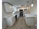 Renovated kitchen with an island and stainless steel appliances and modern cabinets at 538 S 98Th St, Mesa, AZ 85208