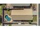 Aerial view of a home showcasing a uniquely shaped pool and well-manicured backyard at 6121 S Ruby Dr, Chandler, AZ 85249