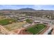 Aerial view of Basha High School, highlighting the athletic fields, track, and facilities with a backdrop of desert scenery at 6121 S Ruby Dr, Chandler, AZ 85249