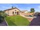 Lush backyard with a well-maintained lawn, mature trees, and a private pool, perfect for outdoor enjoyment at 6121 S Ruby Dr, Chandler, AZ 85249