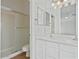 Bright bathroom featuring a shower, double vanity, and large mirror at 6121 S Ruby Dr, Chandler, AZ 85249