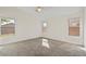 Spacious carpeted bedroom with three windows providing ample natural light at 6121 S Ruby Dr, Chandler, AZ 85249