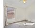 Bedroom with carpet, a bright window, and curtains at 6121 S Ruby Dr, Chandler, AZ 85249