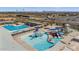 Resort-style community pool featuring a zero-entry splash pad and multiple water slides for endless Gathering fun at 6121 S Ruby Dr, Chandler, AZ 85249