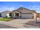 Beautiful one-story home boasts a two-car garage, well-kept lawn, and an inviting facade at 6121 S Ruby Dr, Chandler, AZ 85249