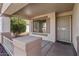 Inviting front porch with stylish pillars and a secure screen door, offering a warm welcome at 6121 S Ruby Dr, Chandler, AZ 85249