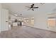 Open living space with carpet and large windows letting in natural light at 6121 S Ruby Dr, Chandler, AZ 85249