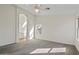 Expansive carpeted main bedroom with ensuite bathroom and a ceiling fan at 6121 S Ruby Dr, Chandler, AZ 85249