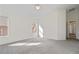 Bright main bedroom with carpet, multiple windows, and access to the ensuite bathroom at 6121 S Ruby Dr, Chandler, AZ 85249