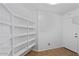 Organized pantry featuring ample shelving and convenient access, perfect for storage solutions at 6121 S Ruby Dr, Chandler, AZ 85249