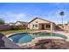 Sparkling private pool with backyard landscaping surrounded by a secure fence; perfect for relaxing and entertaining at 6121 S Ruby Dr, Chandler, AZ 85249