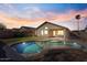Inviting backyard pool, perfect for relaxation, with a covered patio and lush landscaping at 6121 S Ruby Dr, Chandler, AZ 85249