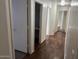 Hallway with wood floors and white trim at 6531 W Hess S St, Phoenix, AZ 85043