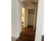 Hallway with wood flooring, leading to closet and other rooms at 6531 W Hess S St, Phoenix, AZ 85043