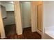 Main bathroom featuring walk-in closet and glass shower at 6531 W Hess S St, Phoenix, AZ 85043