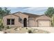 Charming single-story home featuring a two-car garage, desert landscaping, and a welcoming front entrance at 6859 N 190Th Dr, Waddell, AZ 85355