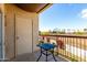 Cozy outdoor balcony with desert views and a black metal table at 7101 W Beardsley Rd # 722, Glendale, AZ 85308