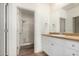 Bathroom features a single sink vanity and a shower with a glass door at 7101 W Beardsley Rd # 722, Glendale, AZ 85308