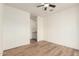Bright bedroom with wood floors leads to a vanity area and a closet at 7101 W Beardsley Rd # 722, Glendale, AZ 85308