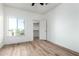 Bedroom with wood floor, closet, window and natural light at 7101 W Beardsley Rd # 722, Glendale, AZ 85308