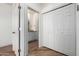 Hallway view showcases white paneled doors and wood-look floors at 7101 W Beardsley Rd # 722, Glendale, AZ 85308