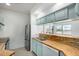 Bright kitchen features stainless steel appliances, light blue cabinets, and a butcher block countertop at 7101 W Beardsley Rd # 722, Glendale, AZ 85308