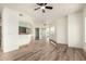 Bright living room featuring wood floors, breakfast bar, natural light, and a ceiling fan at 7101 W Beardsley Rd # 722, Glendale, AZ 85308