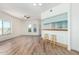 Bright, open floor plan featuring wood floors, breakfast bar, natural light, and a ceiling fan at 7101 W Beardsley Rd # 722, Glendale, AZ 85308