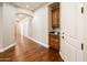 Elegant hallway features hardwood floors, built-in cabinets, and archways leading to other rooms at 720 E Seattle Slew Ln, Gilbert, AZ 85296