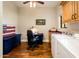 Hardwood-floored laundry room with folding table and extra cabinet storage at 720 E Seattle Slew Ln, Gilbert, AZ 85296