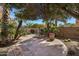 Lush backyard featuring mature trees, decorative fountain, and a peaceful setting for relaxation at 721 W Cherrywood Dr, Chandler, AZ 85248