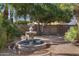 Charming backyard fountain surrounded by lush plants and a decorative tiled patio at 721 W Cherrywood Dr, Chandler, AZ 85248