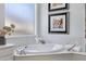 Bathroom offers a soaking tub with bright natural light at 721 W Cherrywood Dr, Chandler, AZ 85248