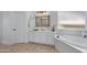 Bathroom offers a soaking tub with bright natural light and a vanity at 721 W Cherrywood Dr, Chandler, AZ 85248